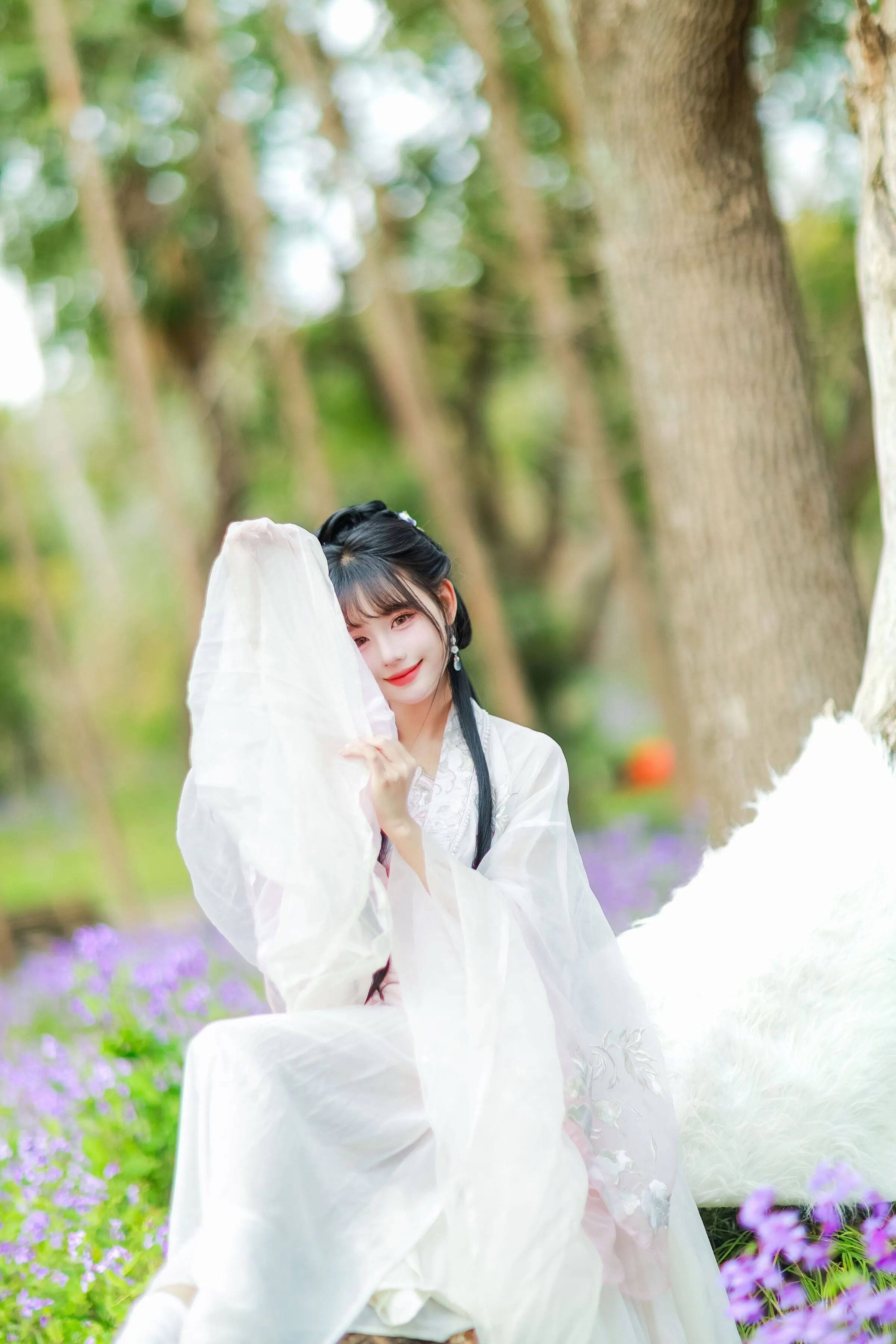 袖遮半面